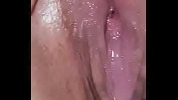 Toying her hairy vag