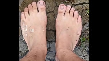 Bare feet playing in the mud