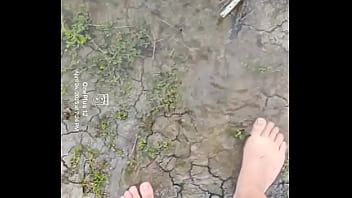 Bare feet playing in the mud