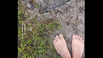 Bare feet playing in the mud