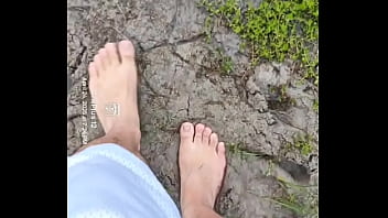 Bare feet playing in the mud