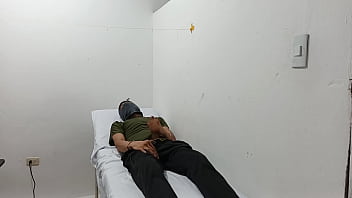 Kinky doctor masturbates his cock in the office