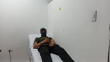 Kinky doctor masturbates his cock in the office