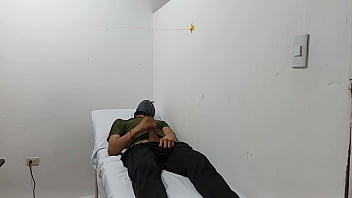 Kinky doctor masturbates his cock in the office