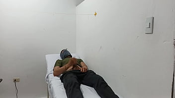 Kinky doctor masturbates his cock in the office