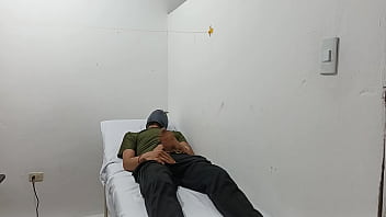 Kinky doctor masturbates his cock in the office