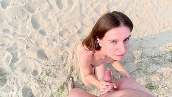 Sucking off my best friend at the public beach and taking cumshot on my pretty face