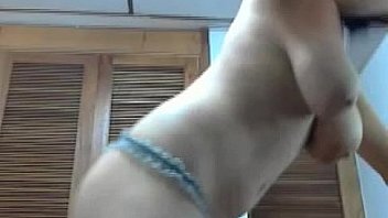 Girl in pink socks camming in her room in glasses