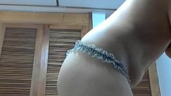 Girl in pink socks camming in her room in glasses