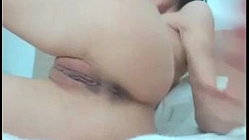 Busty brunette rubs pussy and peels off panties