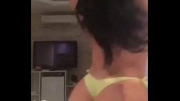 Girl doing a strip on the bed