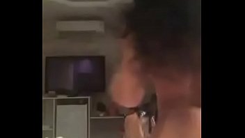 Girl doing a strip on the bed