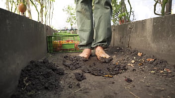 Dirty feet crushing vegetables outdoors Dirty feet crushing vegetables outdoors