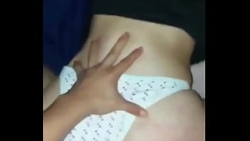 With the thong on one side and the cock all the way to the bottom