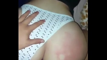 With the thong on one side and the cock all the way to the bottom