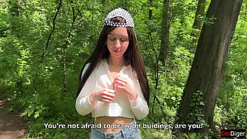 Public sex in the forest with a hooligan girl painting graffiti