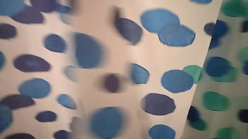 Plump redhead girl touches herself and masturbates under the shower