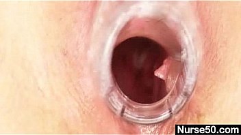 Blond milf in latex uniform extreme dildo insertion