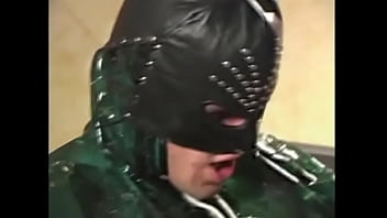 Muscular dude in a black mask fucks a naughty chick wrapped in tape