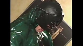 Muscular dude in a black mask fucks a naughty chick wrapped in tape