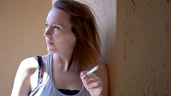 Brunette smoking tease with intense eye contact