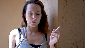 Brunette smoking tease with intense eye contact