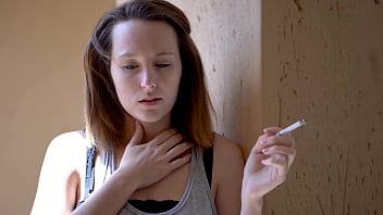 Brunette smoking tease with intense eye contact