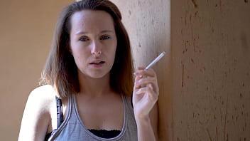 Brunette smoking tease with intense eye contact