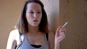 Brunette smoking tease with intense eye contact