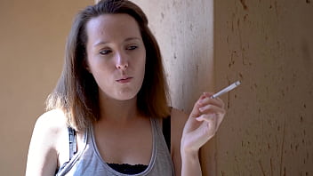 Brunette smoking tease with intense eye contact