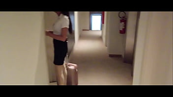 Milf in stockings and heels walks through the corridors of a hotel
