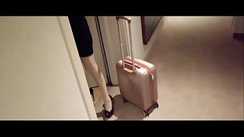 Milf in stockings and heels walks through the corridors of a hotel