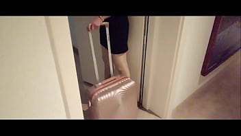 Milf in stockings and heels walks through the corridors of a hotel