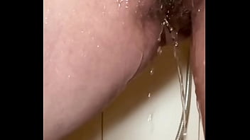 Hairy milf’s pussy shower