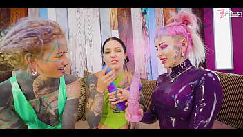 Two dominas gang up on goth chick to fill her holes with toys and make her cum