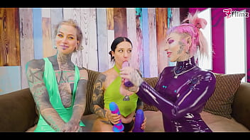 Two dominas gang up on goth chick to fill her holes with toys and make her cum