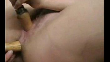 Busty milf inserts machine tools in her holes