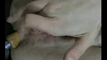 Busty milf inserts machine tools in her holes