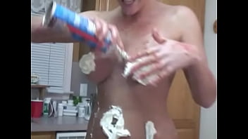 Curvy redhead teen covers herself in whipped cream