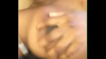 Black girl fondling her boobies