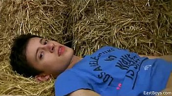 Twink jerks off in hay