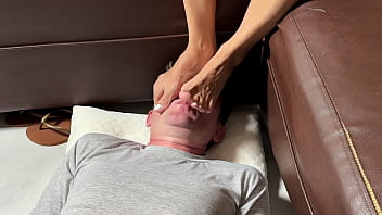 Wife humiliates husband with her sexy feet on his face