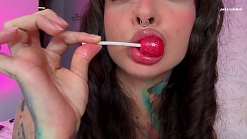 Girl with split tongue licks a lollipop and puts in ass
