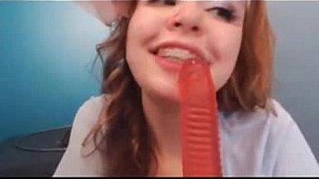 Hot redhead sucks dildo on webcam