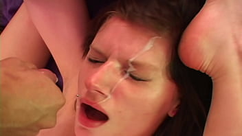 Pretzeled flexible redhead gets fucked and facialed with her feet behind her head