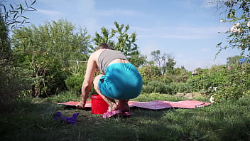 Sexy wife cleaning yoga mat and flashes butt under skirt outdoors