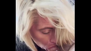 Blonde streetwalker takes a facial in public