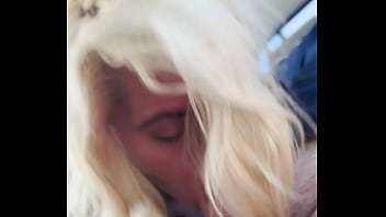 Blonde streetwalker takes a facial in public