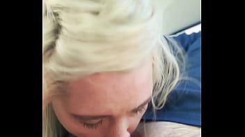 Blonde streetwalker takes a facial in public