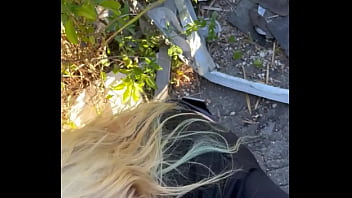 Blonde streetwalker takes a facial in public